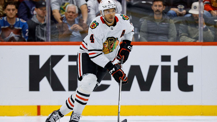 Oct 28, 2024; Denver, Colorado, USA; Chicago Blackhawks defenseman Seth Jones (4) controls the puck in the third period against the Colorado Avalanche at Ball Arena. Mandatory Credit: Isaiah J. Downing-Imagn Images