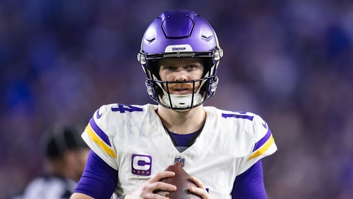 Minnesota Vikings quarterback Sam Darnold waits for a play to begin.