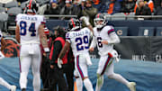 Nov 9, 2025; Chicago, Illinois, USA; New York Giants quarterback Jaxson Dart (6) reacts after rushing for a touchdown against the Chicago Bears during the second half at Soldier Field.  