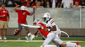 Aug 31, 2024; Tucson, Arizona, USA; Arizona Wildcats defensive back Marquis Groves-Killebrew (20) deflects catch from New Mexico Lobos wide receiver Nic Trujillo (7) during third quarter at Arizona Stadium. Mandatory Credit: Aryanna Frank-Imagn Images