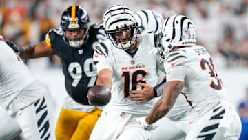 Cincinnati Bengals quarterback Joe Flacco (16) hands off to running back Chase Brown (30) in the second quarter of the NFL Week 7 game between the Cincinnati Bengals and the Pittsburgh Steelers at Paycor Stadium in downtown Cincinnati on Thursday, Oct. 16, 2025.