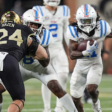 Sep 14, 2024; Winston-Salem, North Carolina, USA;  Mississippi Rebels running back Henry Parrish Jr. (21) runs up the middle against the Wake Forest Demon Deacons during the second half at Allegacy Federal Credit Union Stadium. Mandatory Credit: Jim Dedmon-Imagn Images