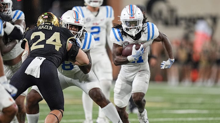 Sep 14, 2024; Winston-Salem, North Carolina, USA;  Mississippi Rebels running back Henry Parrish Jr. (21) runs up the middle against the Wake Forest Demon Deacons during the second half at Allegacy Federal Credit Union Stadium. Mandatory Credit: Jim Dedmon-Imagn Images