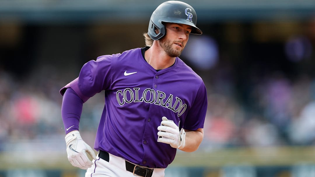 Jun 10, 2025; Denver, Colorado, USA; Colorado Rockies third baseman Ryan McMahon (24) rounds the bases on a solo home run in the fourth inning against the San Francisco Giants at Coors Field. 