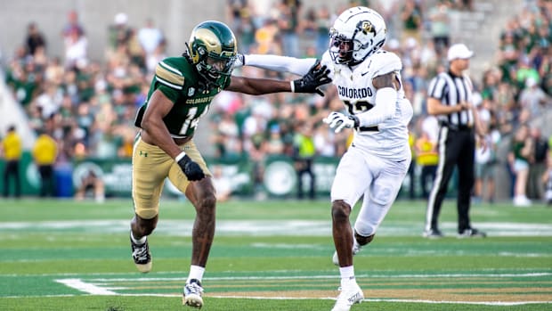 Colorado State wide receiver Tory Horton battles for position with Colorado cornerback Travis Hunter.