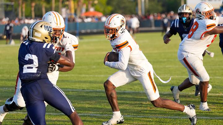 Carol City running back Za'Kari Johnson (9) rushes for a second quarter touchdown against West Boca on Aug. 14,,2026, in Boca Raton, FL.