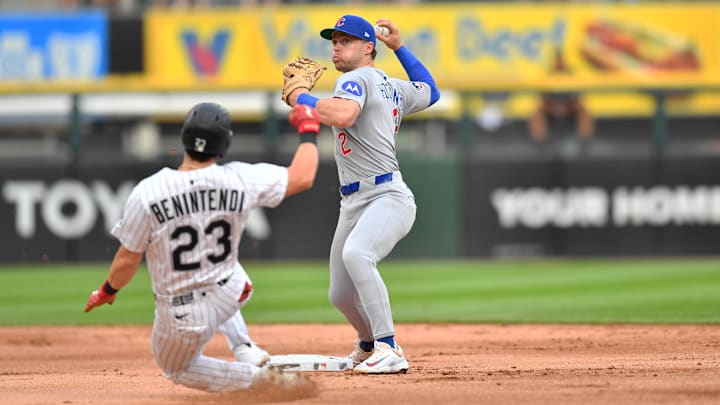 Chicago Cubs second baseman Nico Hoerner (2) turns double play against the Chicago White Sox at Rate Field. Chicago Cubs second baseman Nico Hoerner (2) turns double play against the Chicago White Sox at Rate Field.