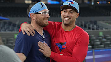 May 13, 2025; Toronto, Ontario, CAN; Toronto Blue Jays outfielder George Springer (4) greets  Tampa Bay Rays catcher Danny Jansen (19) during batting practice before a game at Rogers Centre. Mandatory Credit: Nick Turchiaro-Imagn Images