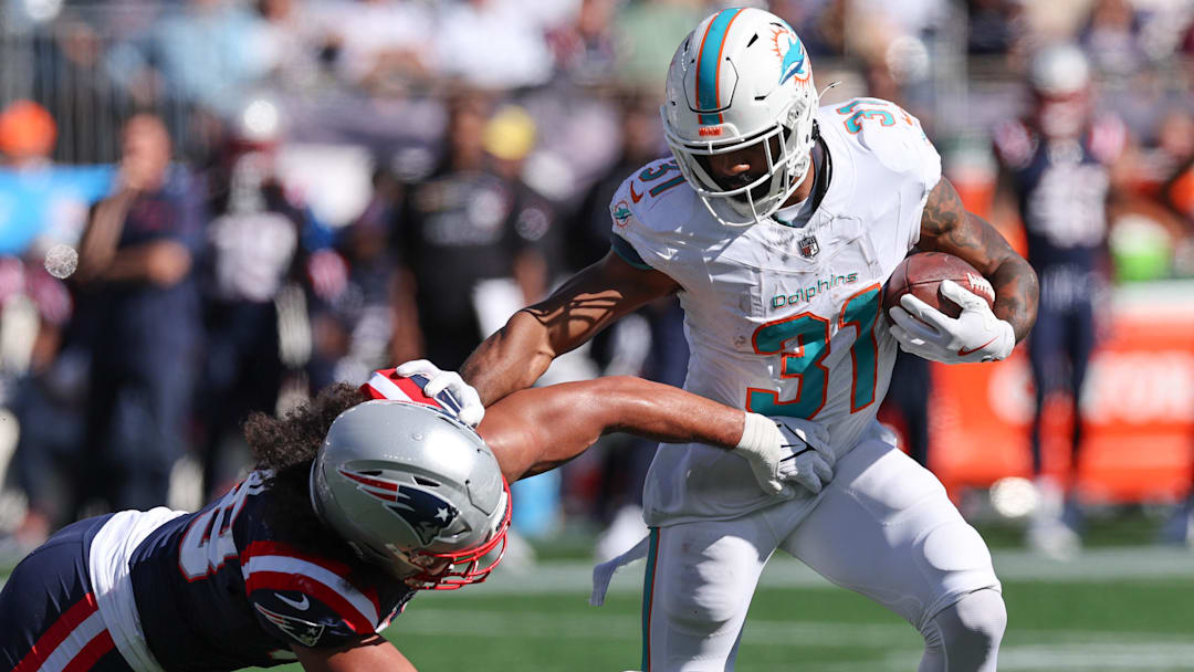Miami Dolphins running back Raheem Mostert (31) runs the ball during the first half against the New England Patriots at Gillette Stadium.