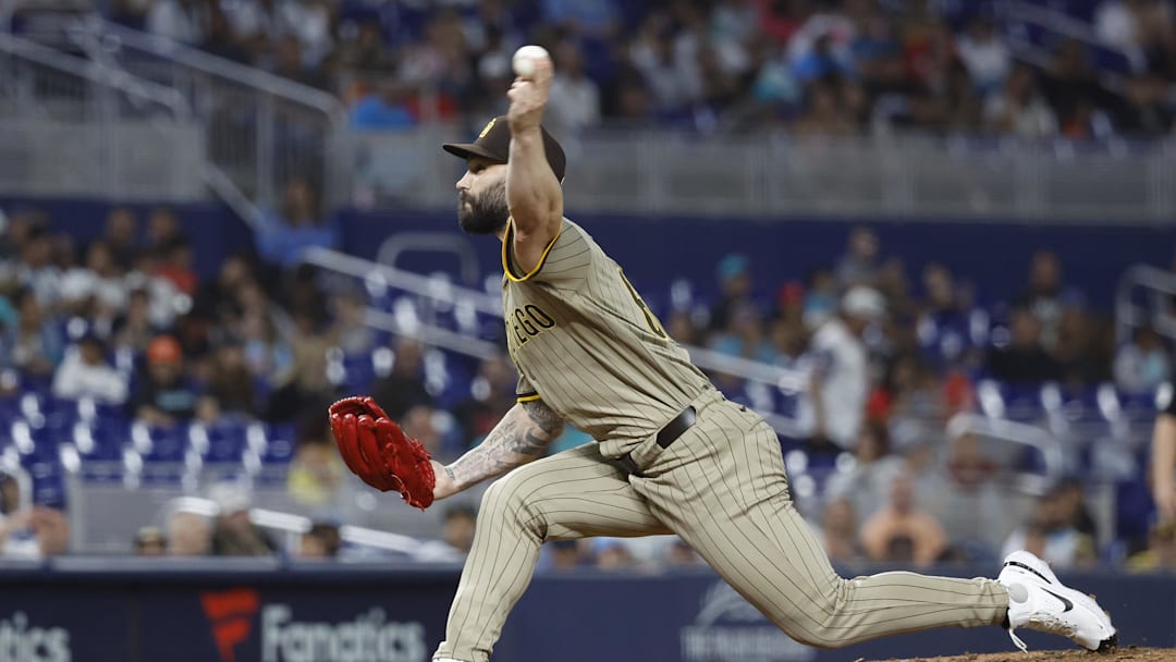 Aug 9, 2024; Miami, Florida, USA;  San Diego Padres relief pitcher Tanner Scott (66) pitches in the tenth inning at loanDepot Park.