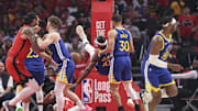 Apr 23, 2025; Houston, Texas, USA; Golden State Warriors forward Jimmy Butler III (10) falls to the floor and suffers an apparent injury during the first quarter during game two of the first round for the 2024 NBA Playoffs against the Houston Rockets at Toyota Center. 