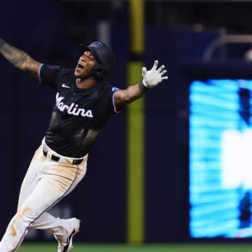 Jun 21, 2024; Miami, Florida, USA; Miami Marlins shortstop Tim Anderson (7) celebrates after hitting a walk-off single against the Seattle Mariners during the tenth inning at loanDepot Park. Mandatory Credit: Sam Navarro-USA TODAY Sports
