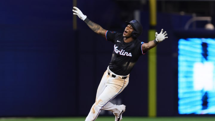 Jun 21, 2024; Miami, Florida, USA; Miami Marlins shortstop Tim Anderson (7) celebrates after hitting a walk-off single against the Seattle Mariners during the tenth inning at loanDepot Park. Mandatory Credit: Sam Navarro-USA TODAY Sports