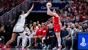 May 17, 2025; Indianapolis, Indiana, USA; Indiana Fever guard Caitlin Clark (22)  shoots the ball while Chicago Sky center Kamilla Cardoso (10) defends in the second half at Gainbridge Fieldhouse. Mandatory Credit: Trevor Ruszkowski-Imagn Images