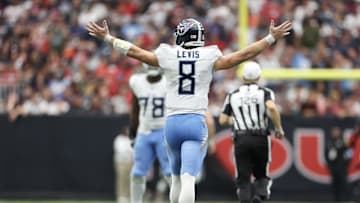 Nov 24, 2024; Houston, Texas, USA; Tennessee Titans quarterback Will Levis (8) celebrates his 70 yard touchdown pass against the Houston Texans in the fourth quarter at NRG Stadium. Mandatory Credit: Thomas Shea-Imagn Images
