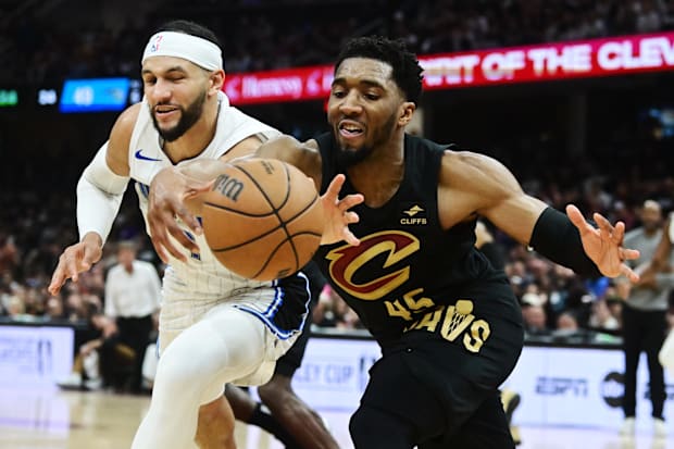 Cleveland Cavaliers guard Donovan Mitchell (45) goes for a loose ball against Orlando Magic guard Jalen Suggs (4) 