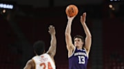 Feb 28, 2024; College Park, Maryland, USA; Northwestern Wildcats guard Brooks Barnhizer (13) shoots over Maryland Terrapins forward Donta Scott (24) during the first half  at Xfinity Center. Mandatory Credit: Tommy Gilligan-Imagn Images