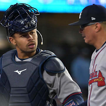 Atlanta Braves catcher Drake Baldwin talks with relief pitcher Jesse Chavez.