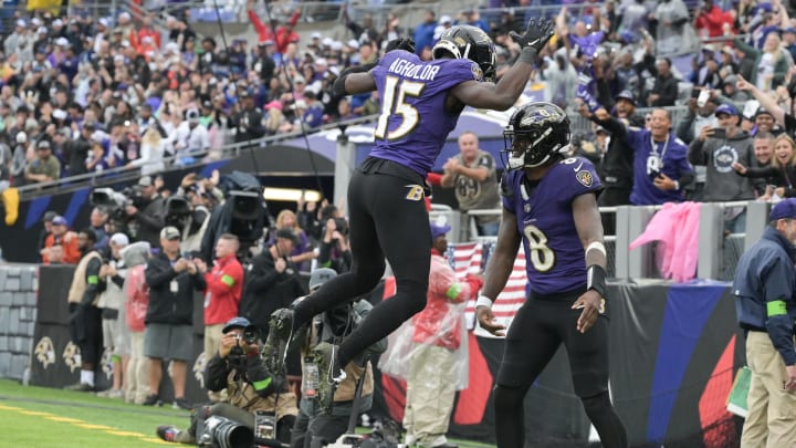 Sep 24, 2023; Baltimore, Maryland, USA; Baltimore Ravens quarterback Lamar Jackson (8) celebrates with a leaping wide receiver Nelson Agholor (15) after scoring a touchdown during the third quarter  against the Indianapolis Colts at M&T Bank Stadium. Mandatory Credit: Tommy Gilligan-USA TODAY Sports