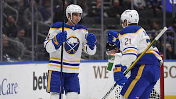 Feb 25, 2022; St. Louis, Missouri, USA; Buffalo Sabres center Dylan Cozens (24) is congradulated by right wing Kyle Okposo (21) after scoring a goal against the St. Louis Blues during the first period at Enterprise Center. Mandatory Credit: Jeff Le-Imagn Images