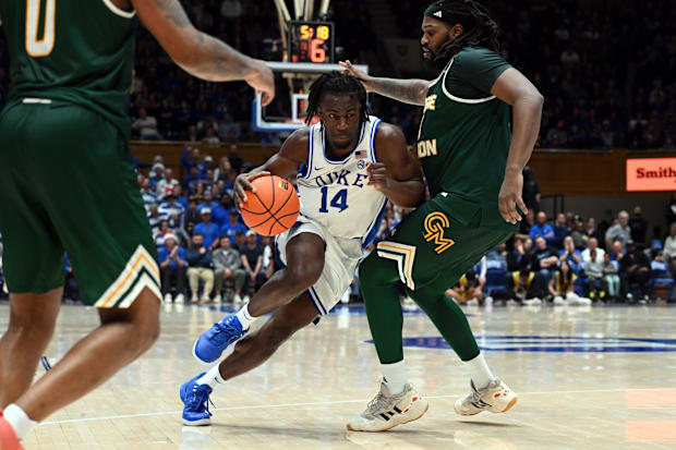 James drives to the basket against George Mason defenders.