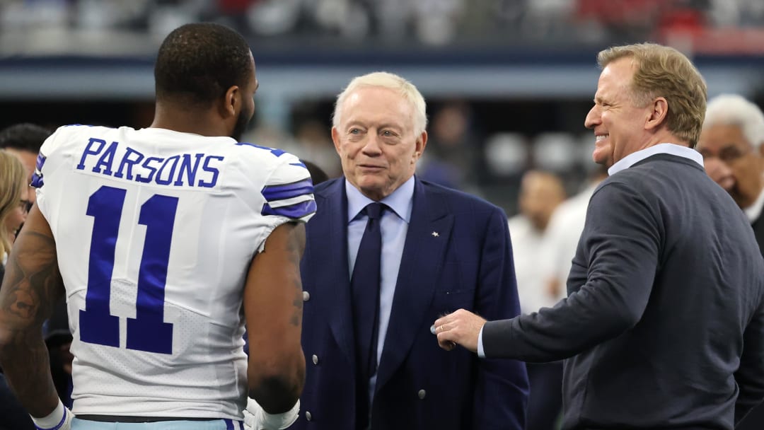 Jan 16, 2022; Arlington, Texas, USA; Dallas Cowboys outside linebacker Micah Parsons (11) meets with owner Jerry Jones (center) and NFL commissioner Roger Goodell (right) prior to the NFC Wild Card playoff football game against the San Francisco 49ers at AT&T Stadium. Mandatory Credit: Kevin Jairaj-USA TODAY Sports