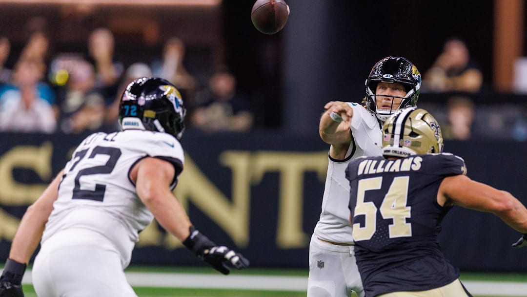 Aug 17, 2025; New Orleans, Louisiana, USA;  New Orleans Saints defensive end Jonah Williams (54) rushes Jacksonville Jaguars quarterback Trevor Lawrence (16) as he passes downfield during the first half at Caesars Superdome. Mandatory Credit: Stephen Lew-Imagn Images