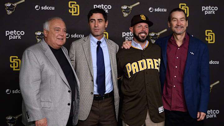 AJ Preller, manager Jayce Tingler and general partner Peter Seidler (from left) pose for a photograph at Petco Park.