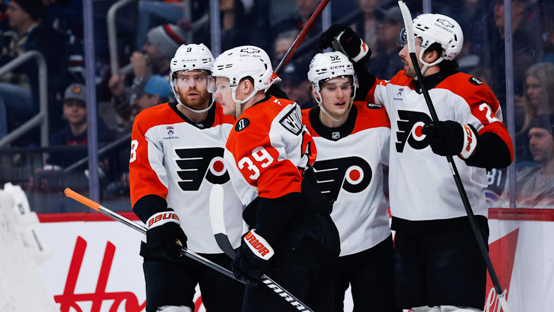 Apr 11, 2026; Winnipeg, Manitoba, CAN;  Philadelphia Flyers forward Matvei Michov (39) is congratulated by his teammates on his goal against the Winnipeg Jets during the first period at Canada Life Centre.