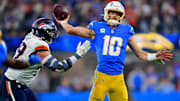 Dec 19, 2024; Inglewood, California, USA; Los Angeles Chargers quarterback Justin Herbert (10) throws as Denver Broncos defensive end Zach Allen (99) moves in during the second half at SoFi Stadium. 