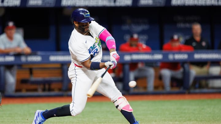 Jun 28, 2024; St. Petersburg, Florida, USA;  Tampa Bay Rays first base Yandy Diaz (2) hits a base hit against the Washington Nationals in the third inning at Tropicana Field. Mandatory Credit: Nathan Ray Seebeck-USA TODAY Sports