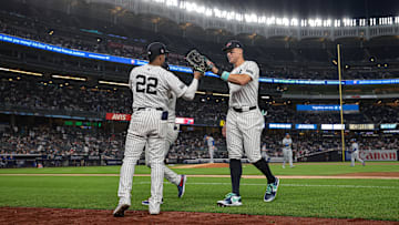 Sep 11, 2024; Bronx, New York, USA; New York Yankees right fielder Juan Soto (22) slaps hands with center fielder Aaron Judge (99) during the fifth inning against the Kansas City Royals at Yankee Stadium. Mandatory Credit: Vincent Carchietta-Imagn Images