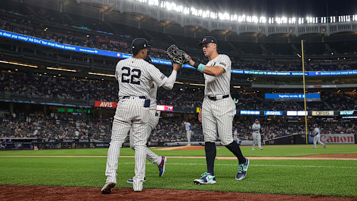 Sep 11, 2024; Bronx, New York, USA; New York Yankees right fielder Juan Soto (22) slaps hands with center fielder Aaron Judge (99) during the fifth inning against the Kansas City Royals at Yankee Stadium. Mandatory Credit: Vincent Carchietta-Imagn Images