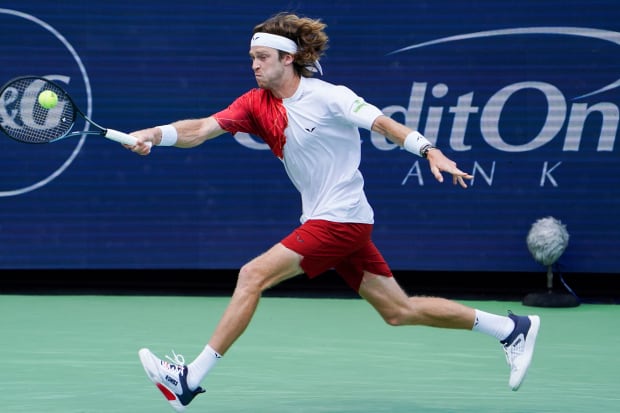 Andrey Rublev wears K-Swiss apparel and shoes on the tennis court.