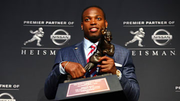 Dec 12, 2015; New York, NY, USA; Alabama running back Derrick Henry poses with the Heisman Trophy during a press conference at the New York Marriott Marquis after winning the trophy during the 81st annual Heisman Trophy presentation. Mandatory Credit: Brad Penner-Imagn Images