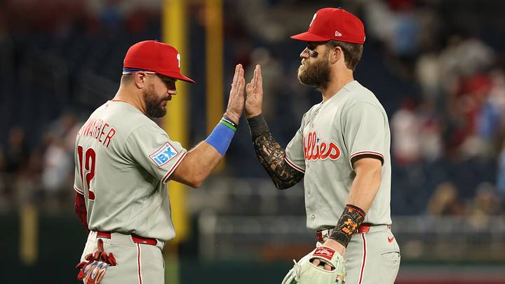 Sep 16, 2026; Washington, District of Columbia, USA; Philadelphia Phillies designated hitter Kyle Schwarber (12) celebrates with Phillies first baseman Bryce Harper (3) after their game against the Washington Nationals at Nationals Park. Mandatory Credit: Geoff Burke-Imagn Images