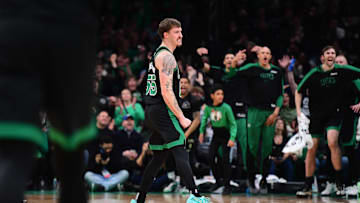 Mar 18, 2025; Boston, Massachusetts, USA; Boston Celtics forward Baylor Scheierman (55) reacts after making a three point shot during the second half against the Brooklyn Nets at TD Garden. Mandatory Credit: Bob DeChiara-Imagn Images