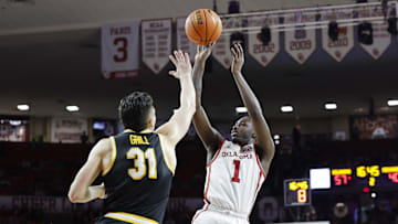 Missouri Tigers forward Caleb Grill (31) attempts to block a shot versus a defender, in a game against the Oklahoma Sooners this season.