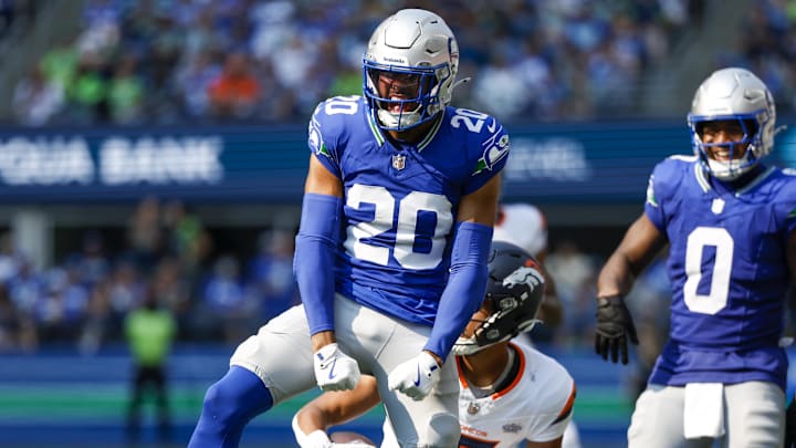 Sep 8, 2024; Seattle, Washington, USA; Seattle Seahawks safety Julian Love (20) celebrates after making a tackle against the Denver Broncos during the third quarter at Lumen Field. Mandatory Credit: Joe Nicholson-Imagn Images