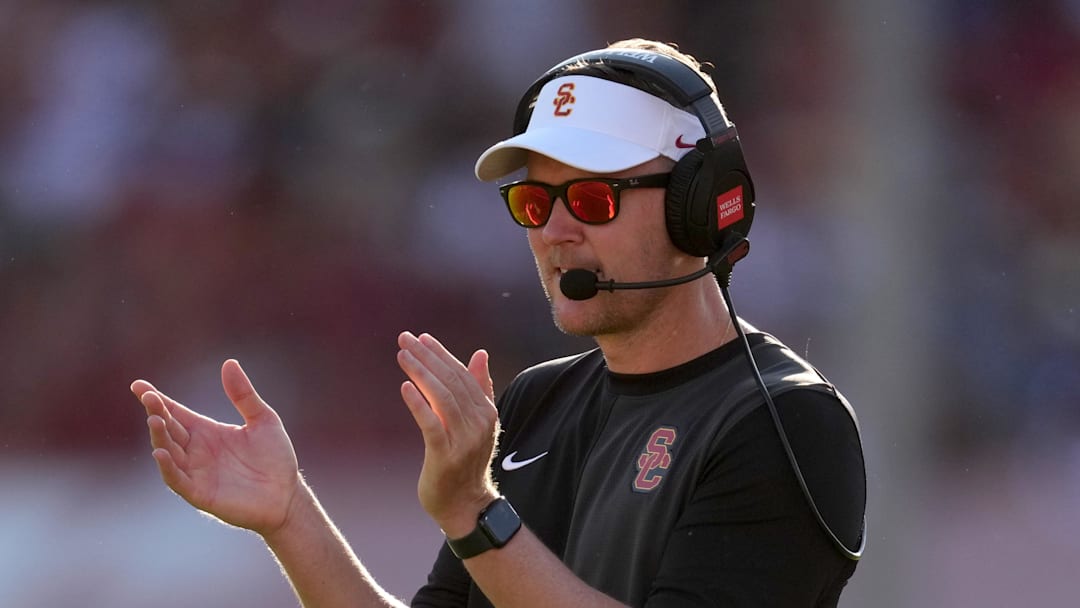 Aug 30, 2025; Los Angeles, California, USA; Southern California Trojans head coach Lincoln Riley watches from the sidelines against the Missouri State Bears in the first half at United Airlines Field at Los Angeles Memorial Coliseum. 