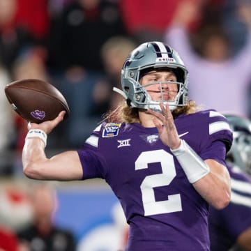 Dec 28, 2023; Orlando, FL, USA;  Kansas State quarterback Avery Johnson throws the ball against NC State in the third quarter at Camping World Stadium. Mandatory Credit: Jeremy Reper-USA TODAY Sports