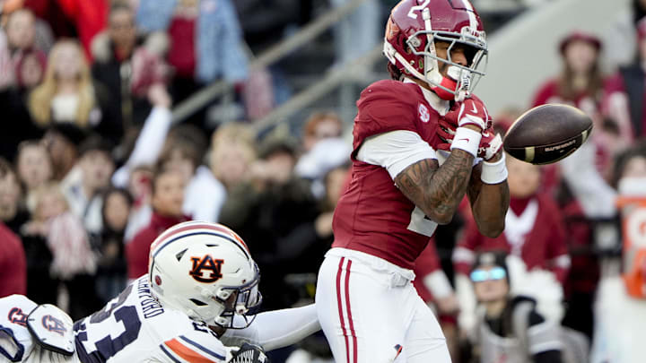 Nov 30, 2024; Tuscaloosa, Alabama, USA;  Alabama Crimson Tide wide receiver Ryan Williams (2) cannot catch a pass in the end zone against Auburn Tigers cornerback Jay Crawford (23) during the first half at Bryant-Denny Stadium. Mandatory Credit: Gary Cosby Jr.-Imagn Images