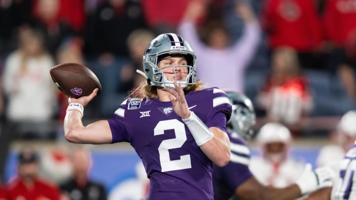 Dec 28, 2023; Orlando, FL, USA;  Kansas State quarterback Avery Johnson throws the ball against NC State in the third quarter at Camping World Stadium. Mandatory Credit: Jeremy Reper-USA TODAY Sports