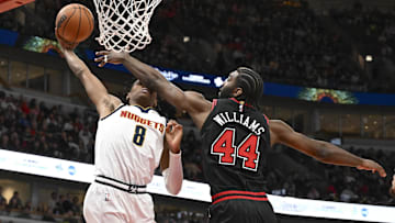 Jan 27, 2025; Chicago, Illinois, USA; Denver Nuggets forward Peyton Watson (8) shoots against Chicago Bulls forward Patrick Williams (44)