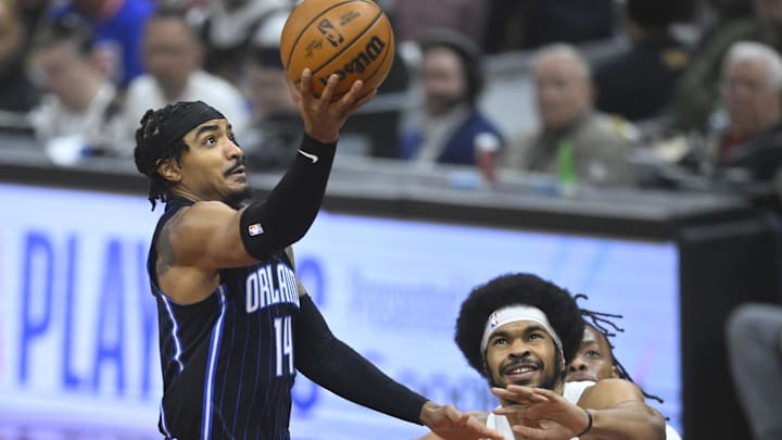 Orlando Magic guard Gary Harris (14) drives to the basket beside Cleveland Cavaliers center Jarrett Allen (31) in the first quarter during game two of the first round of the 2024 NBA playoffs at Rocket Mortgage FieldHouse.