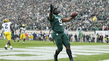 Oct 30, 2021; East Lansing, Michigan, USA; Michigan State Spartans running back Kenneth Walker III (9) celebrates after rushing for a touchdown during the fourth quarter against the Michigan Wolverines at Spartan Stadium. Mandatory Credit: Raj Mehta-Imagn Images