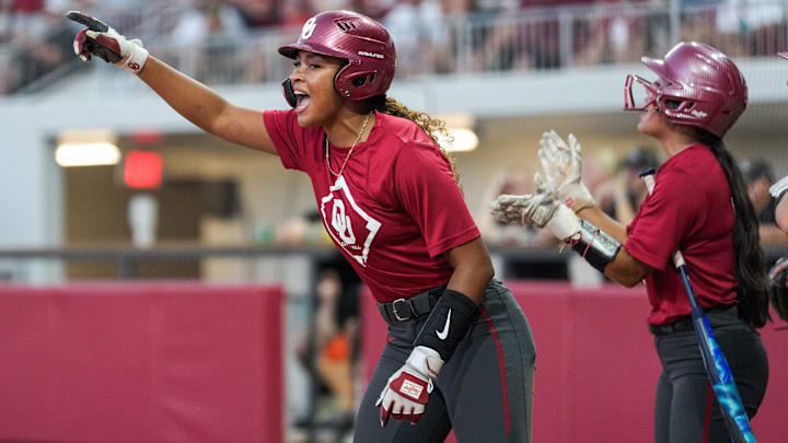 Sophomore left fielder Tia Milloy celebrates scoring a run during an exhibition game against Oklahoma Christian University at Love’s Field on Oct. 15 in Norman, Okla.
