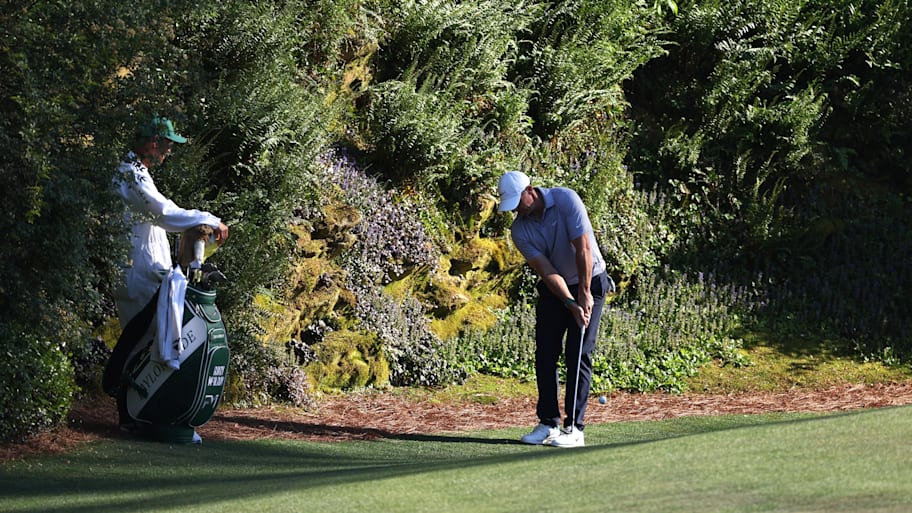 McIlroy was left with a difficult chip on the par-3 12th hole after pulling his tee shot. 