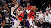 Mar 14, 2025; Salt Lake City, Utah, USA;  Toronto Raptors guard RJ Barrett (9) passes the ball away from Utah Jazz forward Lauri Markkanen (23) during the second quarter at Delta Center. Mandatory Credit: Chris Nicoll-Imagn Images