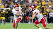Tempe, Arizona, USA; Houston Cougars quarterback Conner Weigman (1) hands off the ball to running back Dean Connors (44) against the Arizona State Sun Devils at Mountain America Stadium.